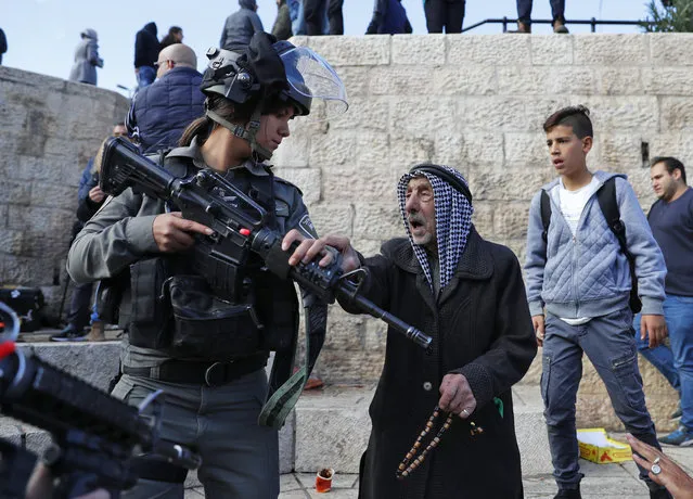 Israeli forces disperse Palestinian protestors outside Damascus Gate in Jerusalem's Old City on December 7, 2017. US President Donald Trump's recognition of Jerusalem as Israel's capital sparked a Palestinian general strike and a call for a new intifada as fears grew of fresh bloodshed in the region. (Photo by Ahmad Gharabli/AFP Photo)