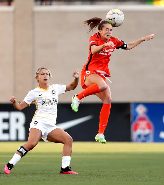 Houston Dash forward Shea Groom (6) heads the ball over Utah Royals FC midfielder Lo'eau LaBonta (9) as the Utah Royals and the Houston Dash play in the Challenge Cup quarterfinals at Zions Bank Stadium in Herriman Utah on Friday, July 17, 2020. (Photo by Scott G. Winterton/Deseret News)