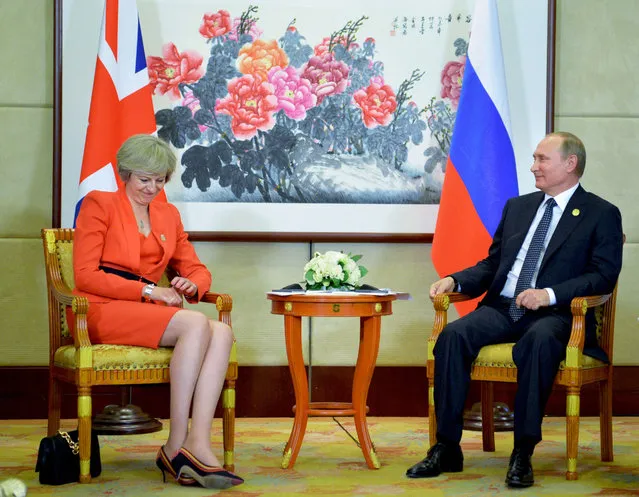 Russian President Vladimir Putin (R) meets with Britain's Prime Minister Theresa May on the sidelines of the G20 Leaders Summit in Hangzhou on September 4, 2016. (Photo by Alexei Druzhinin/AFP Photo/Sputnik)