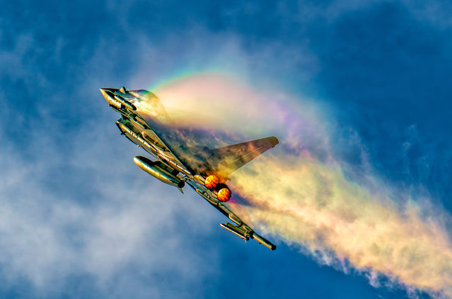 The picture dated February 24, 2025 shows Squadron Leader Nathan Sawyer, the RAF Typhoon display pilot for the 2025 season, practising over RAF Coningsby in Lincolnshire ahead of this year's airshows. Wisps of rainbow vapour were seen coming out of the tail as he put the plane through its paces at 1500ft. (Photo by Claire Hartley/Bav Media)