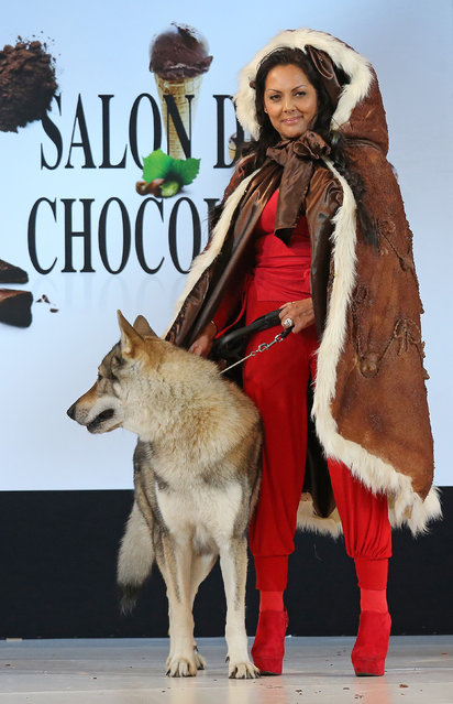 A model wears a creation made with chocolate during a fashion show at the inauguration of the 20th annual Salon du Chocolat in Paris on October 28, 2014. The show,  the world's biggest dedicated to chocolate, brings together fashion designers and chocolatiers from around the world. (Photo by David Silpa/UPI)