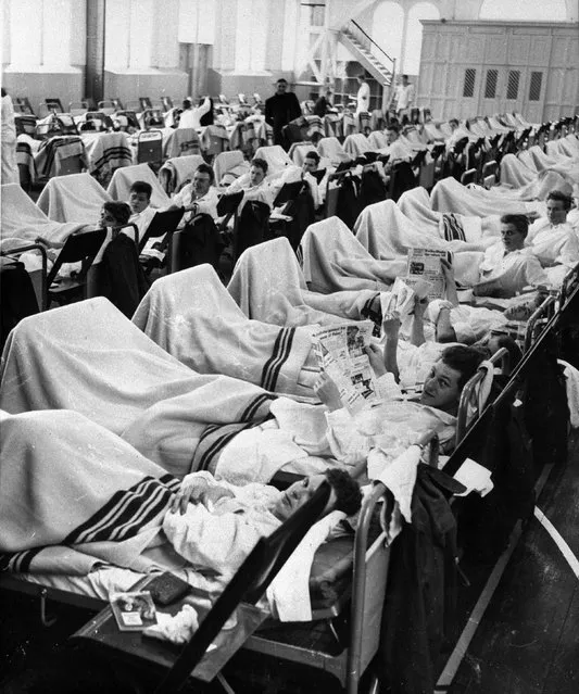 Danish personnel suffering from influenza occupy beds in temporary sick quarters set up in a gymnasium at Copenhagen's naval shipyard to handle the large amount of patients on October 12, 1957. On Wednesday, April 13, 2005, scientists around the world were scrambling to prevent the possibility of a pandemic after a nearly 50-year-old killer influenza virus was sent to thousands of labs, a decision that one researcher described as “unwise”. (Photo by AP Photo)