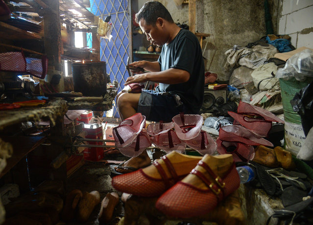 A worker produces shoes at a home shoe factory in Bogor, West Java, Indonesia on April 16, 2025. U.S. President Donald Trump imposes a new import tariff of 32 percent on products from Indonesia. With the additional tariff, the total burden on Indonesian products could reach 37 percent. This tariff dramatically impacts exports such as electronics, footwear, and garments, contributing significantly to Indonesia's trade surplus with the U.S. of $16.84 billion in 2024. (Photo by Adriana Adie/NurPhoto/Rex Features/Shutterstock)