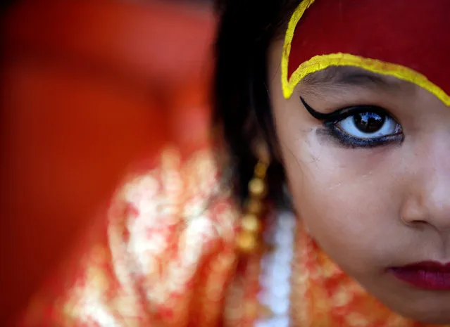 A young girl dressed as the Living Goddess Kumari takes part in the Kumari Puja festival in Kathmandu, Nepal September 14, 2016. (Photo by Navesh Chitrakar/Reuters)