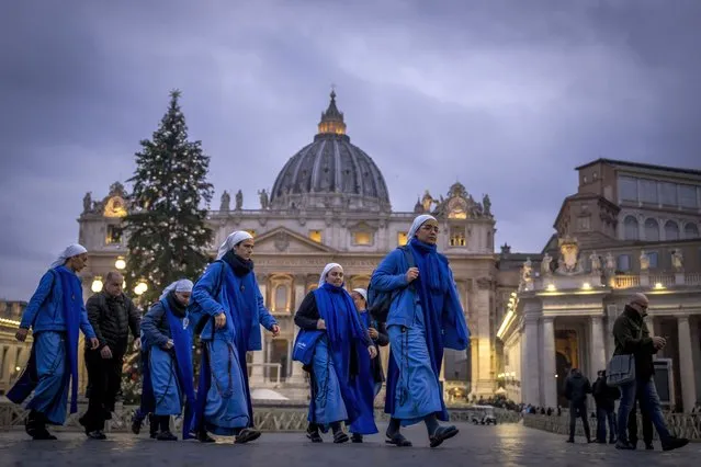 Nuns arrive at dawn to view the body of Pope Emeritus Benedict XVI as it lies in state in St. Peter's Basilica at the Vatican, Tuesday, January 3, 2023. The Vatican announced that Pope Benedict died on Dec. 31, 2022, aged 95, and that his funeral will be held on Thursday, Jan. 5, 2023. (Photo by Ben Curtis/AP Photo)