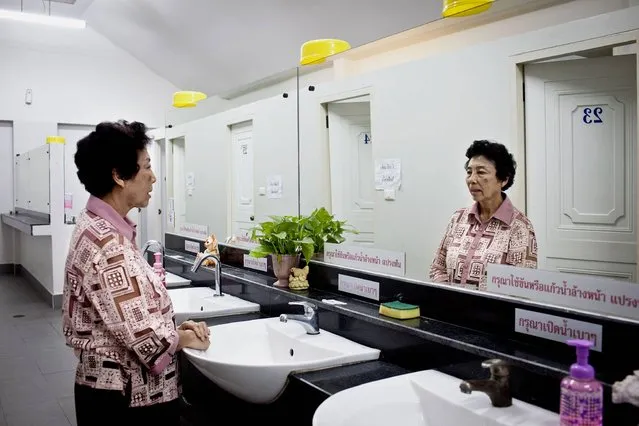 Thailand. Sineha, 71, uses a public toilet which is inside the temple she visits. “They are convenient and cleaned daily by the maid. It is a safe place because we have security guards here 24 hours a day and separate toilets for men and women”. (Photo by Patrick Brown/WSUP/Panos)