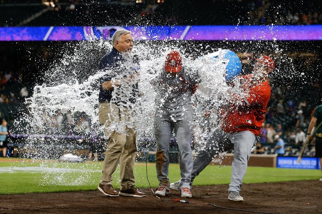 St. Louis Cardinals first baseman Willson Contreras (40) is hit with ice water during an interview after the game against the Colorado Rockies at Coors Field in Denver, Colorado on July 21, 2025. (Photo by Isaiah J. Downing/Imagn Images)