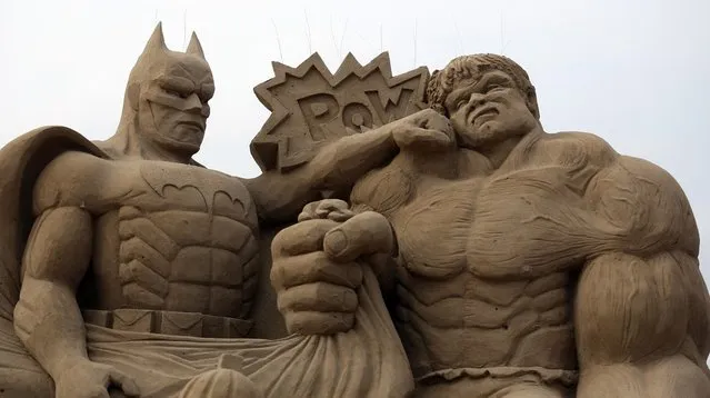 Detail of a sand sculpture of Batman and The Incredible Hulk is seen as pieces are prepared as part of this year's Hollywood themed annual Weston-super-Mare Sand Sculpture festival on March 26, 2013 in Weston-Super-Mare, England. Due to open on Good Friday, currently twenty award winning sand sculptors from across the globe are working to create sand sculptures including Harry Potter, Marilyn Monroe and characters from the Star Wars films as part of the town's very own movie themed festival on the beach.  (Photo by Matt Cardy)
