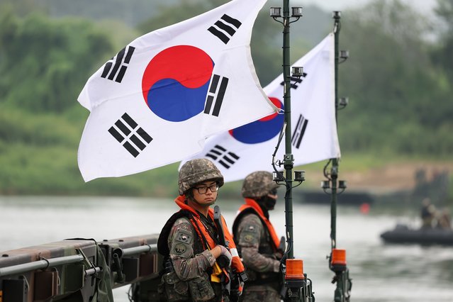 South Korean soldiers participate in a river crossing exercise as part of the Ulchi Freedom Shield exercise on August 27, 2025 in Yeoju-gun, South Korea. The 11-day Ulchi Freedom Shield exercise is a regular joint military exercise between U.S. and South Korean troops to prepare for potential emergencies on the Korean Peninsula. (Photo by Chung Sung-Jun/Getty Images)