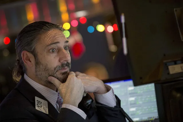 A trader works on the floor of the New York Stock Exchange December 15, 2014. (Photo by Brendan McDermid/Reuters)