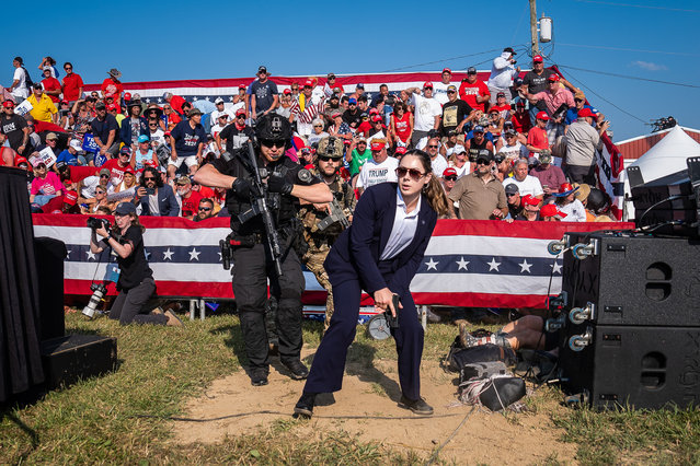 Members of the US secret service scramble toward the stage as Donald Trump fell while speaking as shots rang out during a campaign rally at in Butler, Pennsylvania in 2024. (Photo by Jabin Botsford/Siena awards festival 2025)