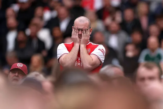 An Arsenal fan looks dejected during the Premier League match between West Ham United and Arsenal FC at London Stadium on April 16, 2023 in London, England. (Photo by Alex Pantling/Getty Images)
