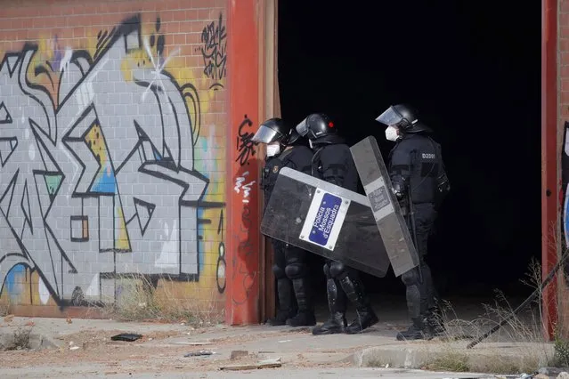 Catalonian regional police 'Mossos d'Esquadra' evict the illegal 40-hour-rave celebrated in Llinars del Valles, Barcelona province, Catalonia region, north-eastern Spain, 02 January 2021. The party began on New Year's Eve and brought together over 200 people from several European countries in violation of the restrictions imposed by the coronavirus pandemic. (Photo by Alejandro Garcia/EPA/EFE)