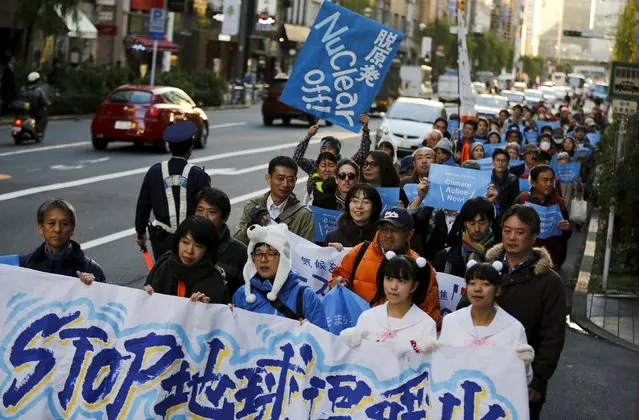People march through central Tokyo ahead of the 2015 Paris Climate Conference, known as the COP21 summit, November 28, 2015. (Photo by Thomas Peter/Reuters)