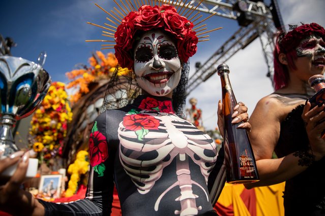With a giant Ofrenda as a backdrop, revelers celebrate DÌa de Muertos with Tequila Don Julio on Sunday, November 3, 2024 in Cape Town. (Photo by Samantha Reinders/AP Content Services for Tequila Don Julio)