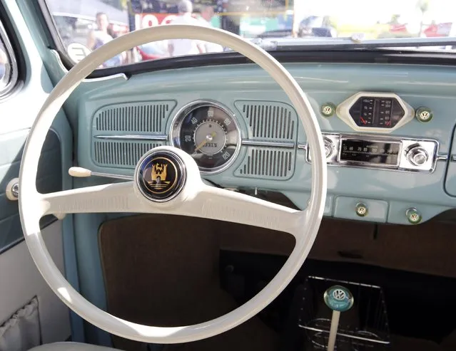 The steering wheel, speedometer and fuel gauge of a 1959 Volkswagen beetle are seen during a Volkswagen Beetle owners' meeting in Sao Bernardo do Campo January 25, 2015. (Photo by Paulo Whitaker/Reuters)