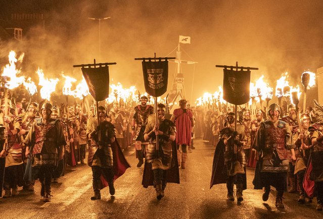 The Jarl Squad take part in the torch procession through Lerwick on the Shetland Isles during the Up Helly Aa festival on Tuesday, January 28, 2025. Originating in the 1880s, the festival celebrates Shetland's Norse heritage. More than 1,000 torches are lit on the last Tuesday in January as two processions, one in the morning and a second in the evening, take place. (Photo by Jane Barlow/PA Wire)
