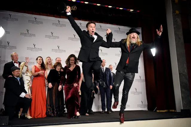 Christer Akerlund (R) and Anders Lundin from “Allt For Sverige” jump from the stage in the press room with the International Emmy award in the Non-scripted Entertainment category in Manhattan, New York, U.S. November 21, 2016. (Photo by Mark Kauzlarich/Reuters)