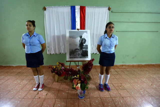 Two girls stand at a tribute to Fidel Castro in Coliseo, Cuba, November 29, 2016. (Photo by Ivan Alvarado/Reuters)