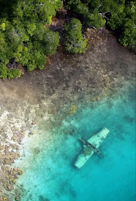 In this aerial image, debris of Imperial Japan Navy Type Zero Reconnaissance Seaplane remains at shallow water on September 1, 2016 in Solomon Islands. (Photo by The Asahi Shimbun via Getty Images)
