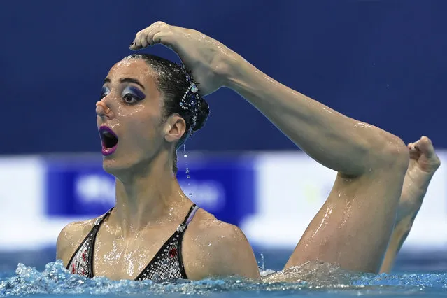 Austria's Anna Maria Alexandri and Austria's Eirini Alexandri compete in the preliminary for the Duet Free Artistic Swimming event during the LEN European Aquatics Championships at the Duna Arena in Budapest on May 11, 2021. (Photo by Attila Kisbenedek/AFP Photo)