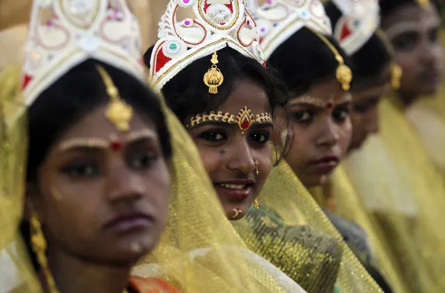 Brides attend a mass marriage ceremony in Kolkata, February 14, 2012. (Photo by Rupak De Chowdhuri/Reuters)
