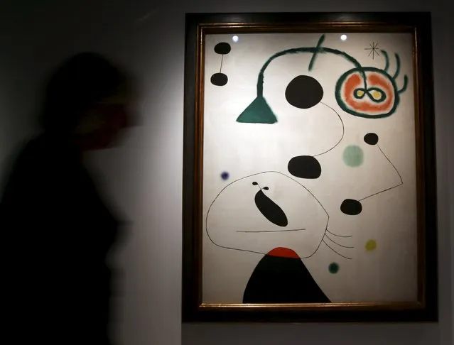 A person walks in front of the painting “Figure and Bird in the Night” from 1945 by Spanish artist Joan Miro at the exhibition “Picasso and the Spanish modernity” at Centro Cultural Banco do Brazil in Sao Paulo March 25, 2015. (Photo by Paulo Whitaker/Reuters)