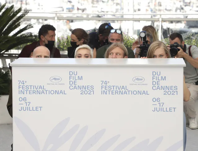 Yury Kolokolnikov, from left, Chulpan Khamatova, Ivan Dorn, and Yulia Peresild pose for photographers at the photo call for the film “Petrov's Flu” at the 74th international film festival, Cannes, southern France, Tuesday, July 13, 2021. (Photo by Vianney Le Caer/Invision/AP Photo)