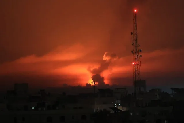 A fireball erupts during overnight Israeli bombardment in the Gaza Strip on October 24, 2023. Thousands of civilians, both Palestinians and Israelis, have died since October 7, 2023, after Palestinian Hamas militants based in the Gaza Strip entered southern Israel in an unprecedented attack triggering a war declared by Israel on Hamas with retaliatory bombings on Gaza. (Photo by Said Khatib/AFP Photo)