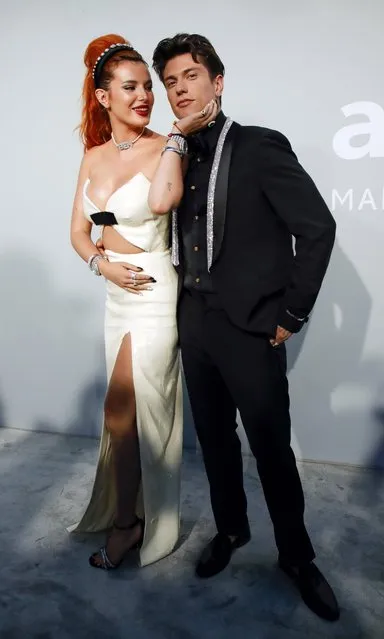 US actress Bella Thorne (L) and Italian singer Benjamin Mascolo arrive on July 16, 2021 to attend the amfAR 27th Annual Cinema Against AIDS gala at the Villa Eilenroc in Cap d'Antibes, southern France, on the sidelines of the 74th Cannes Film Festival. (Photo by Sarah Meyssonnier/Reuters)