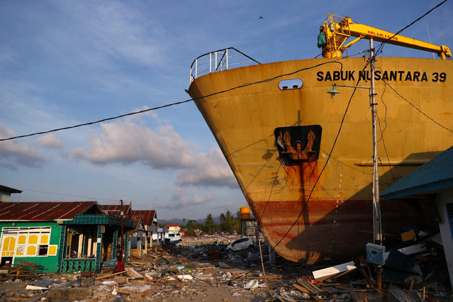 A ship is seen stranded on shore after an earthquake and tsunami hit the area in Wani, Donggala, Central Sulawesi, Indonesia, October 3, 2018. (Photo by Athit Perawongmetha/Reuters)