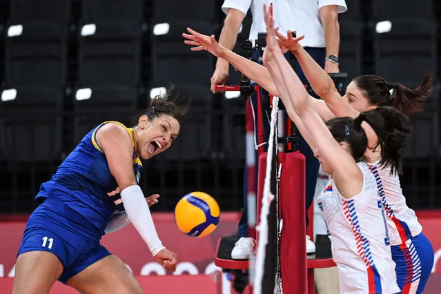 Brazil's Tandara Caixeta spikes the ball in the women's preliminary round pool A volleyball match between Serbia and Brazil during the Tokyo 2020 Olympic Games at Ariake Arena in Tokyo on July 31, 2021. (Photo by Jung Yeon-Je/AFP Photo)