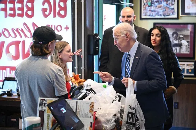 US President Joe Biden speaks to staff as he picks up his order at Primanti Bros. sandwich shop in Moon Township, Pennsylvania, on October 20, 2022. (Photo by Mandel Ngan/AFP Photo)