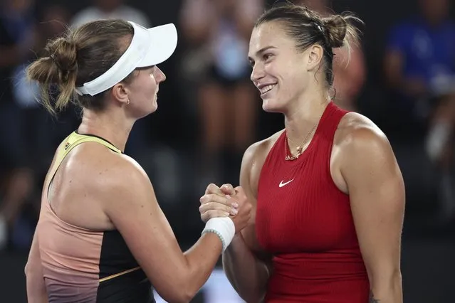 Aryna Sabalenka, right, of Belarus is congratulated by Barbora Krejcikova of the Czech Republic following their quarterfinal match at the Australian Open tennis championships at Melbourne Park, Melbourne, Australia, Tuesday, January 23, 2024. (Photo by Asanka Brendon Ratnayake/AP Photo)