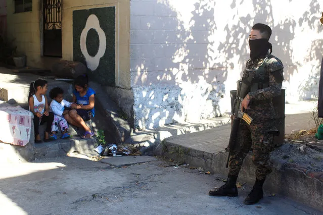 Children play prior to a ceremony to declare their communities a peace zone at La Selva neighborhood in Ilopango, El Salvador, February 3, 2017. Inhabitants of southern Ilopango declared their neighborhoods as violence-free zones to lower homicide rates in one of the most violent areas of El Salvador. (Photo by Jose Cabezas/Reuters)