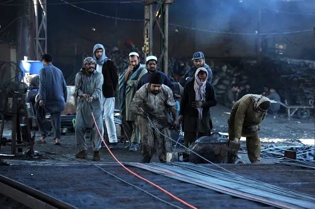 Afghan men work at iron factory in Jalalabad, Afghanistan, 22 February 2016. Although Afghanistan's economy has reportedly improved, the country still relies on foreign aid for more than 90 per cent of national income, and ongoing unrest which has increased with the partial withdrawal of foreign troops January 2015 has further damaged potential for economic growth. (Photo by Ghulamullah Habibi/EPA)