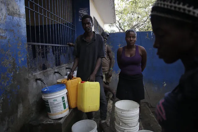 Haitians fill containers at a water kiosk in Port-au-Prince, Haiti, March 8, 2016. March 22 marks World Water Day. (Photo by Andres Martinez Casares/Reuters)