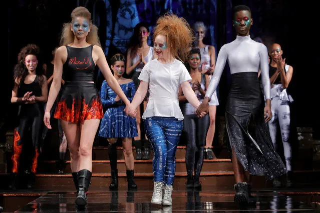 Australian model and designer Madeline Stuart, who has Down syndrome, acknowledges attendees after presenting creations from her label 21 Reasons Why By Madeline Stuart during New York Fashion Week in Manhattan, New York, U.S., February 12, 2017. Less than two years after making her runway debut, Madeline Stuart, a model with Down syndrome, launched her own fashion label on Sunday at New York Fashion Week with a collection of sporty leggings, crop tops and skirts. The Australian-born model challenged fashion industry norms with her first catwalk appearance in 2015 and is credited with changing perceptions about people with Down syndrome. She hopes to do the same with her new label, 21 Reasons Why by Madeline Stuart. Wearing blue patterned leggings, Stuart kicked off the packed show that featured casual looks designed for comfort and ease. She paired short flared skirts with long and shirt-sleeve crop tops and T-shirts that could be mixed and matched with dark and patterned leggings. “It really does represent who she is”, Roseanne Stuart, Madeline's mother, manager and design collaborator, said about the collection that will be sold exclusively online. The collection's name is a nod to Stuart turning 21 this year and the extra copy of chromosome 21 that is characteristic of Down syndrome. (Photo by Andrew Kelly/Reuters)