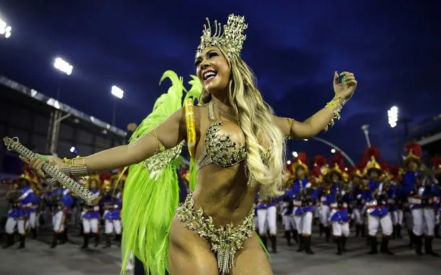 A dancer from the Academicos do Tatuape samba school performs during a Carnival parade in Sao Paulo. (Photo by Andre PennerAssociated Press)