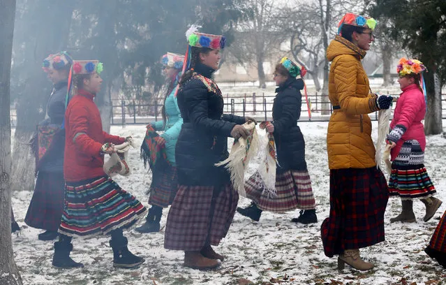 Girls take part in a festive game during celebration of Maslenitsa, or Pancake Week, in the Rachen village, Belarus, February 26, 2017. (Photo by Vasily Fedosenko/Reuters)