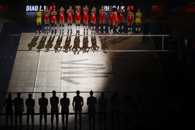 Chinese players, top, and South Korean players, line up at the start of their Volleyball Women's Nations League match, at the Maracanazinho stadium in Rio de Janeiro, Brazil, Tuesday, May 14, 2024. (Photo by Bruna Prado/AP Photo)