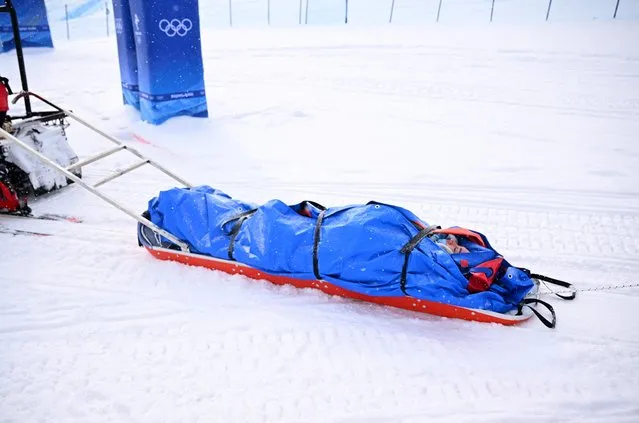 Belle Brockhoff of Team Australia is stretched off the mountain after crashing during the Snowboard Mixed Team Cross Quarterfinals on Day 8 of the Beijing 2022 Winter Olympics at Genting Snow Park on February 12, 2022 in Zhangjiakou, China. (Photo by Dylan Martinez/Reuters)