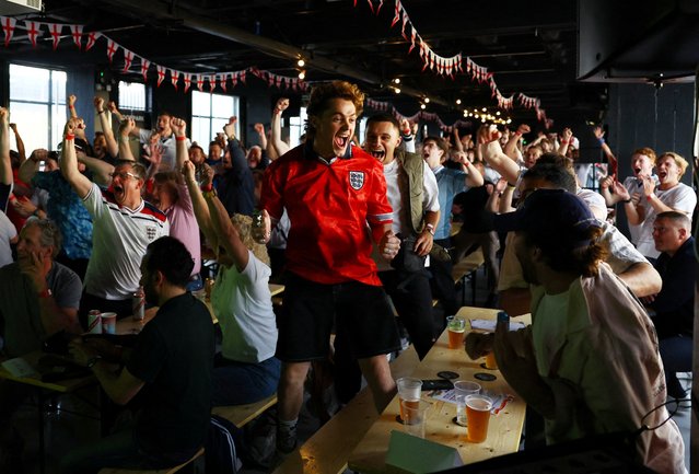 England fans at 4TheFans Fans Park in Dalston celebrate after Jude Bellingham scored their first goal against Serbia in their Euro 2024 match on June 16, 2024. (Photo by Matthew Childs/Action Images via Reuters)