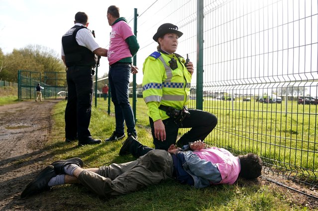 Protesters are detained by police during day three of the Randox Grand National Festival at Aintree Racecourse, Liverpool on Saturday, April 15, 2023. (Photo by Tim Goode/PA Images via Getty Images)