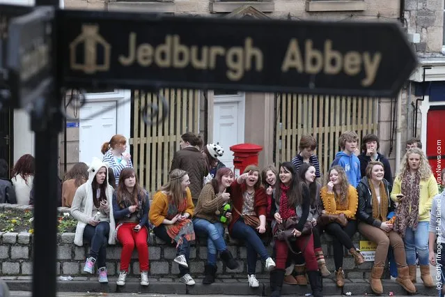 Girls gather to watch the annual 'Fastern Eve Handba' event in Jedburgh's High Street in the Scottish Borderson March