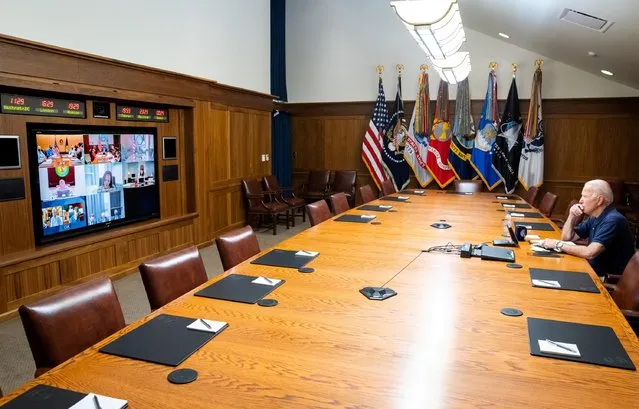 U.S. President Joe Biden is seen during a meeting with Vice President Kamala Harris, their security team and senior officials to obtain updates on the draw down of civilian personnel in Afghanistan, evacuations of SIV applicants and other Afghan allies, and the ongoing security situation in Kabul, in this handout photo obtained from The White House Twitter account on August 16, 2021. (Photo by Twitter @WhiteHouse/Handout via Reuters)