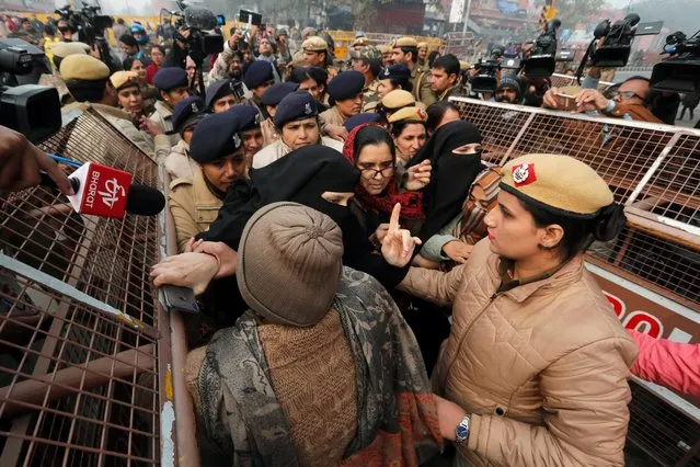 Police officers detain demonstrators during a protest against a new citizenship law at Red Fort in Delhi, India, December 19, 2019. (Photo by Adnan Abidi/Reuters)