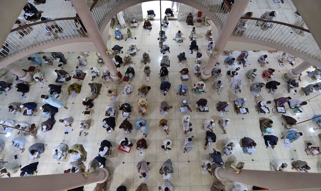 Pakistani religious students of the Jamia Binoria Aalamia Islamic take seminary mid-term exams, in the southern port city of Karachi, Pakistan, 09 September 2024. Students of the Jamia Binoria Aalamia seminary attended the Wafaq-ul Madaris ul Arabia Pakistan (Federal Arabic Islamic Schools Board) examinations. (Photo by Shahzaib Akber/EPA/EFE)