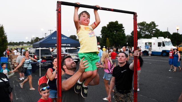 Colin Donnelly, 5 of Evesham, does pull-ups while attending Evesham Township Police's National Night Out event held outside of the Evesham Municipal Complex on Tuesday, August 27, 2024. (Photo by Chris Lachall/USA TODAY Network)