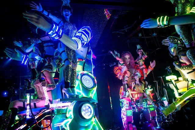 Dancers perform on large scale female robots during a show at The Robot Restaurant on June 29, 2014 in Tokyo, Japan. The now famous Robot Restaurant opened two years ago in Kabukicho area of Shinjuku at an estimated cost of 10 million U.S. dollars. (Photo by Chris McGrath/Getty Images)